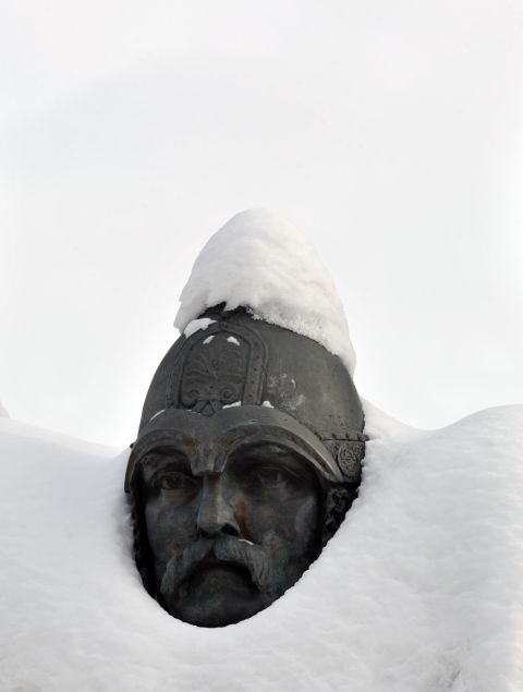 A monument is covered with snow in Kiev on February, 6, 2012 after heavy snowfalls in Ukraine. Ukraine on Monday blamed alcohol abuse as the main cause of deaths caused by a spell of abnormally cold weather that has claimed at least 135 lives over the last 10 days.