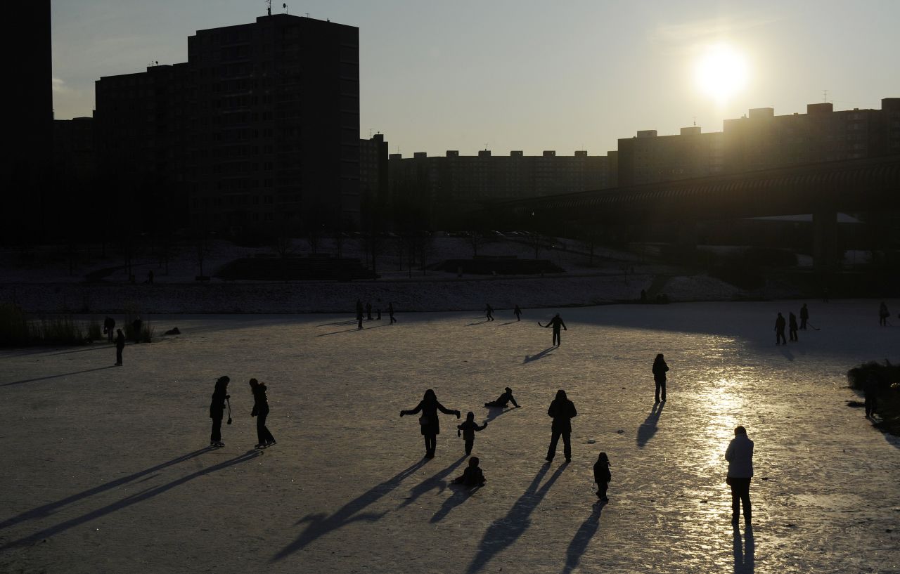 People skate on a frozen pond in Prague on February 6, 2012. Meteorologists this morning measured minus 39.4 degrees Celsius, the coldest temperature of this winter, in Kvilda village, in the South Bohemian Sumava mountains. 