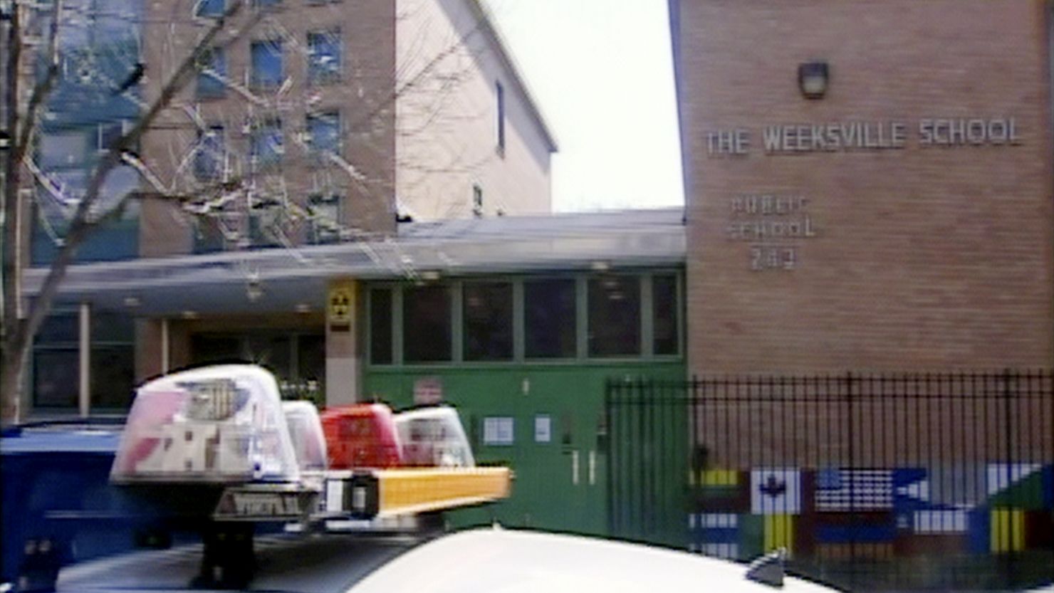 A Brooklyn teacher's aide was accused Tuesday of making videos of himself spanking a naked child and fondling another.