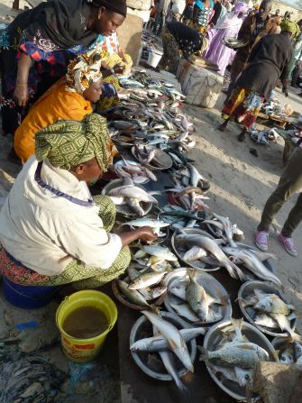 Wives of fisherman act as "brokers" helping them sell to local vendors. 