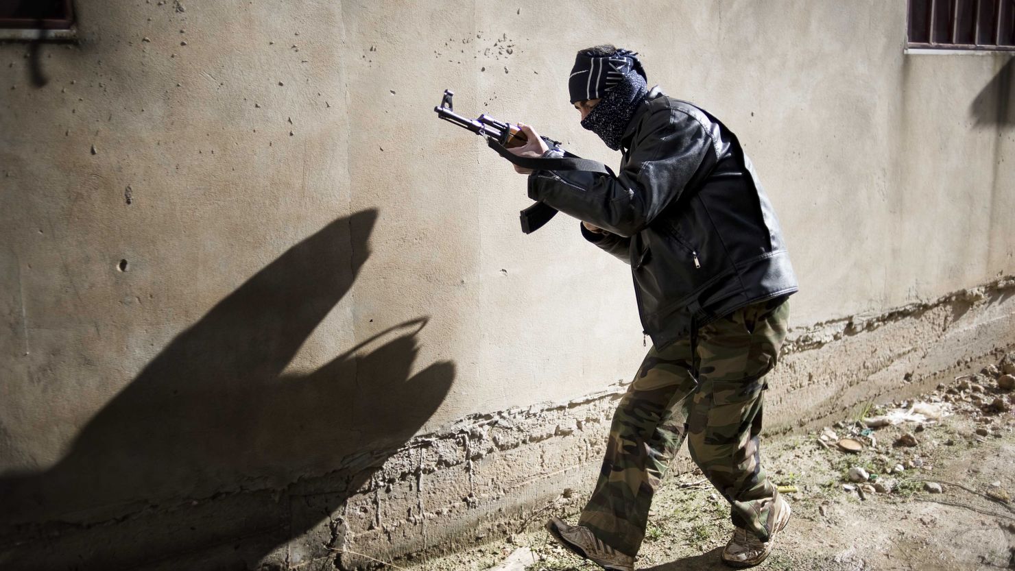 A member of the Free Syrian Army takes position in Al-Qsair, southwest of the flashpoint city Homs, on January 27. 