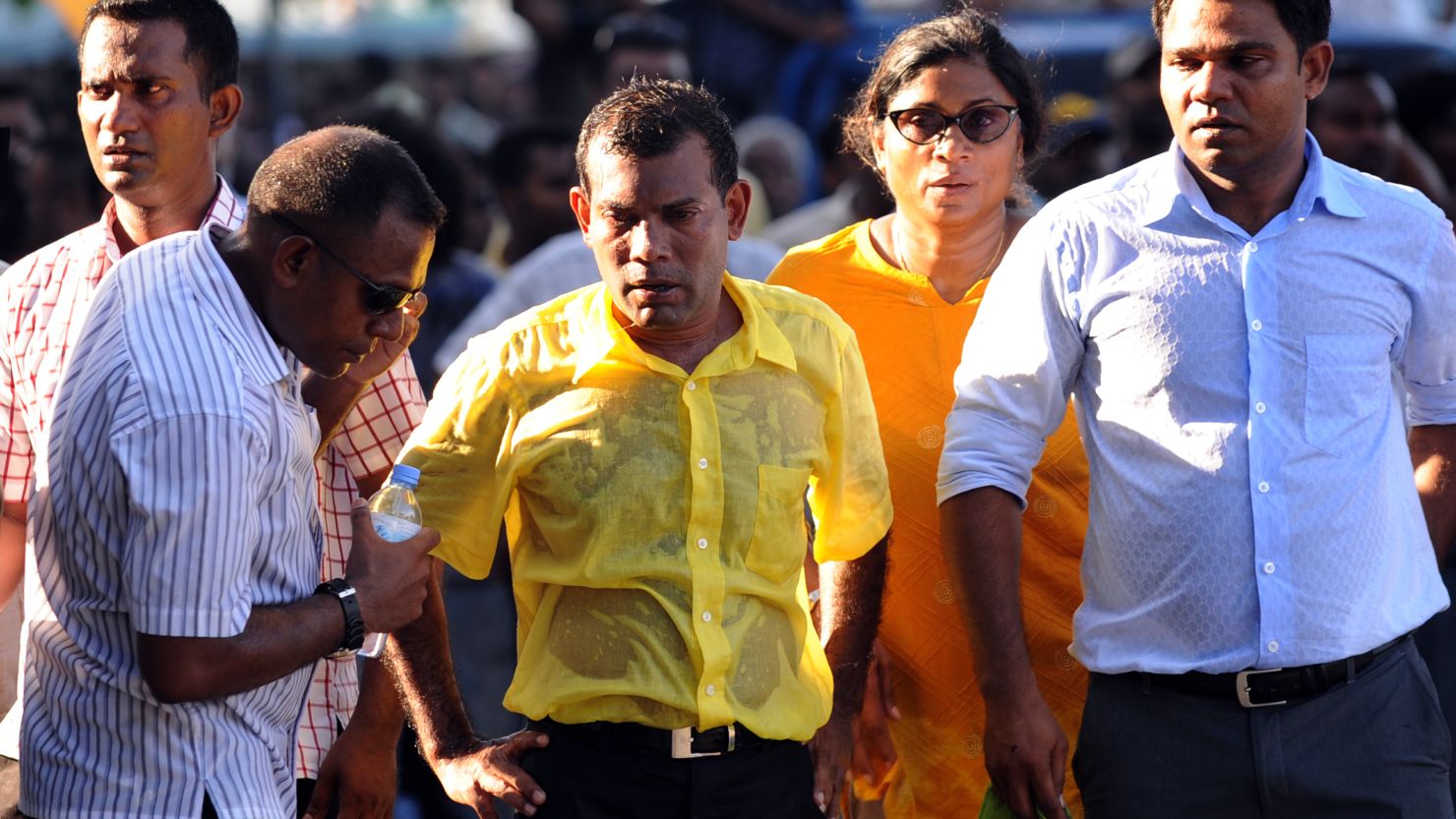 Former Maldivian president Mohamed Nasheed, center, is soaked in sweat in a street protest in the capital Male on February 8.