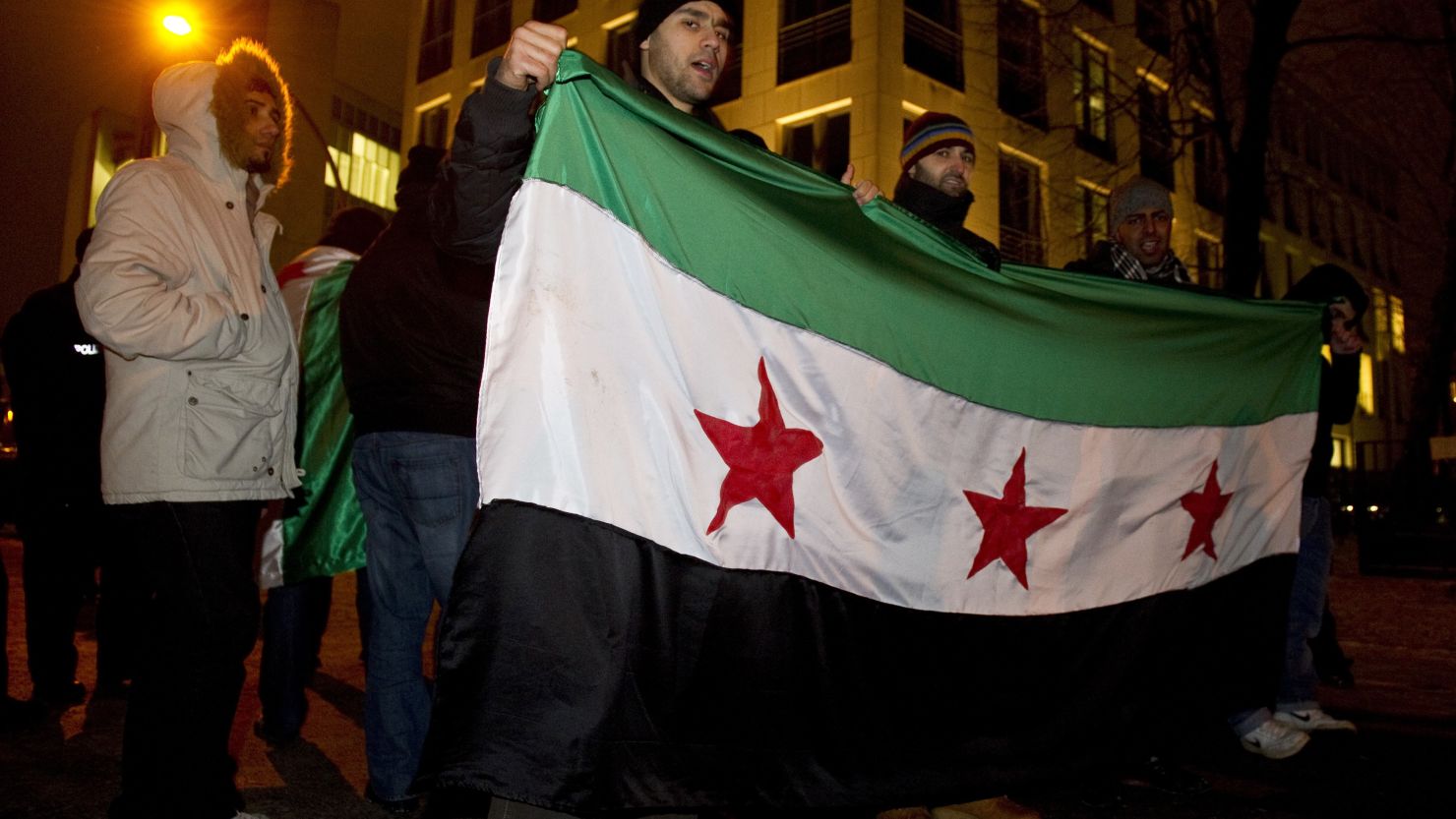 Activists protest against Syrian President Bashar al-Assad outside Syrian embassy in Berlin on February 3, 2012.