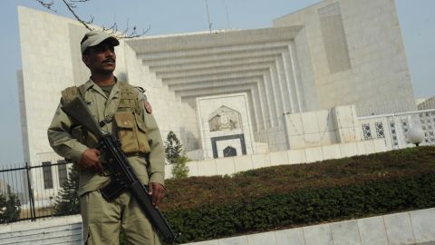 A Pakistani paramilitary soldier stands guard outside the supreme court building in Islamabad on February 2, 2012.