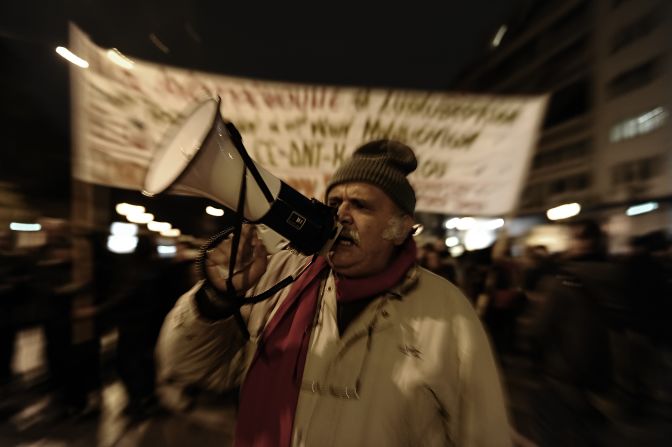 A protester shouts slogans in front of the parliament during a demonstration in Athens on February 9, 2012. Greece's main unions called a 48-hour strike, the second this week, over new austerity cuts agreed by the country's coalition government in return for bailout loans.