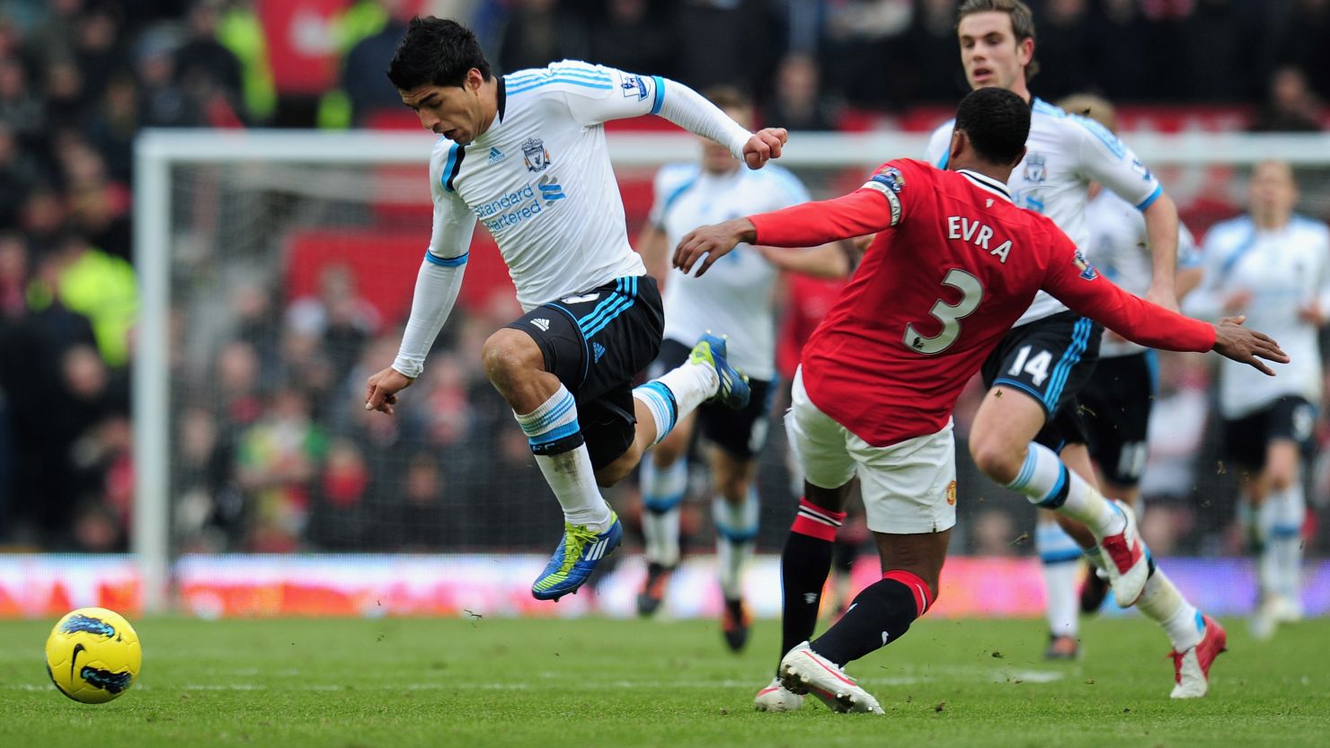 Liverpool's Luis Suarez and Man United's Patrice Evra clash on during a controversial encounter at Old Trafford on Saturday.