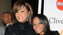 Whitney Houston, left, and Bobbi Kristina Brown arrive at a pre-Grammy event in February 2011 in Beverly Hills, California.