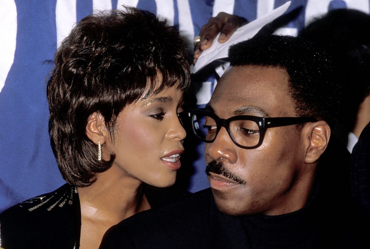 Houston and comedian/actor Eddie Murphy attend the United Negro College Fund's 10th annual Lou Rawls Parade of Stars telethon kickoff party in November 1989 in Beverly Hills, California. 