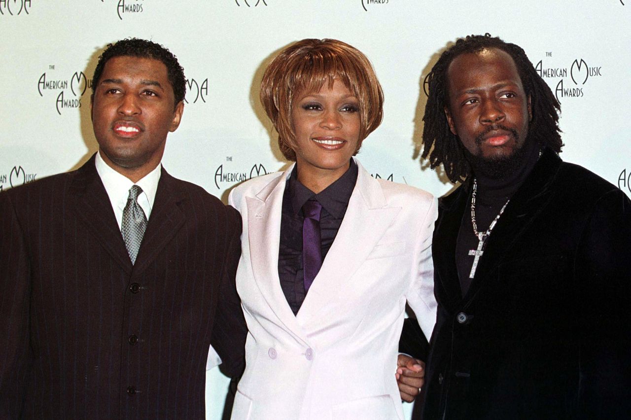 Kenneth "Babyface" Edmonds, left, Houston and Wyclef Jean pose for photographers after performing at the 26th annual American Music Awards in January 1999 in Los Angeles.   