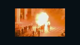 Greek protestors throw fire bombs at police.