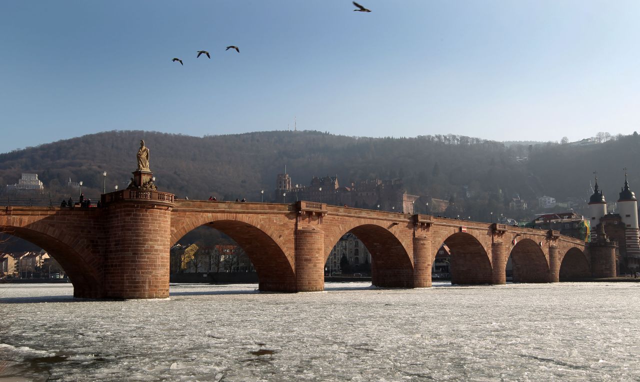 The castle and the old bridge are seen over the frozen river Neckar in Heidelberg, southwestern Germany, on February 12, 2012. Temperatures remain cold in Germany as the death toll from Europe's big freeze rose past 550. 