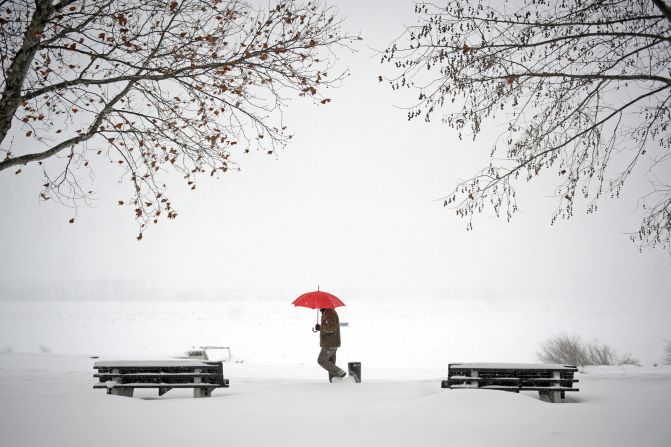 A man walks through snow covered banks of the Danube river in Zemun near Belgrade on February 12, 2012. Cold weather claimed seven more lives on Sunday in the Balkans -- two in Albania, one in Serbia and Bosnia respectively, while three more victims of an avalanche that buried several houses in a southern Kosovo village were found.
