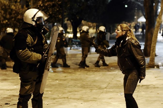 A protester shouts at a riot policeman during clashes.