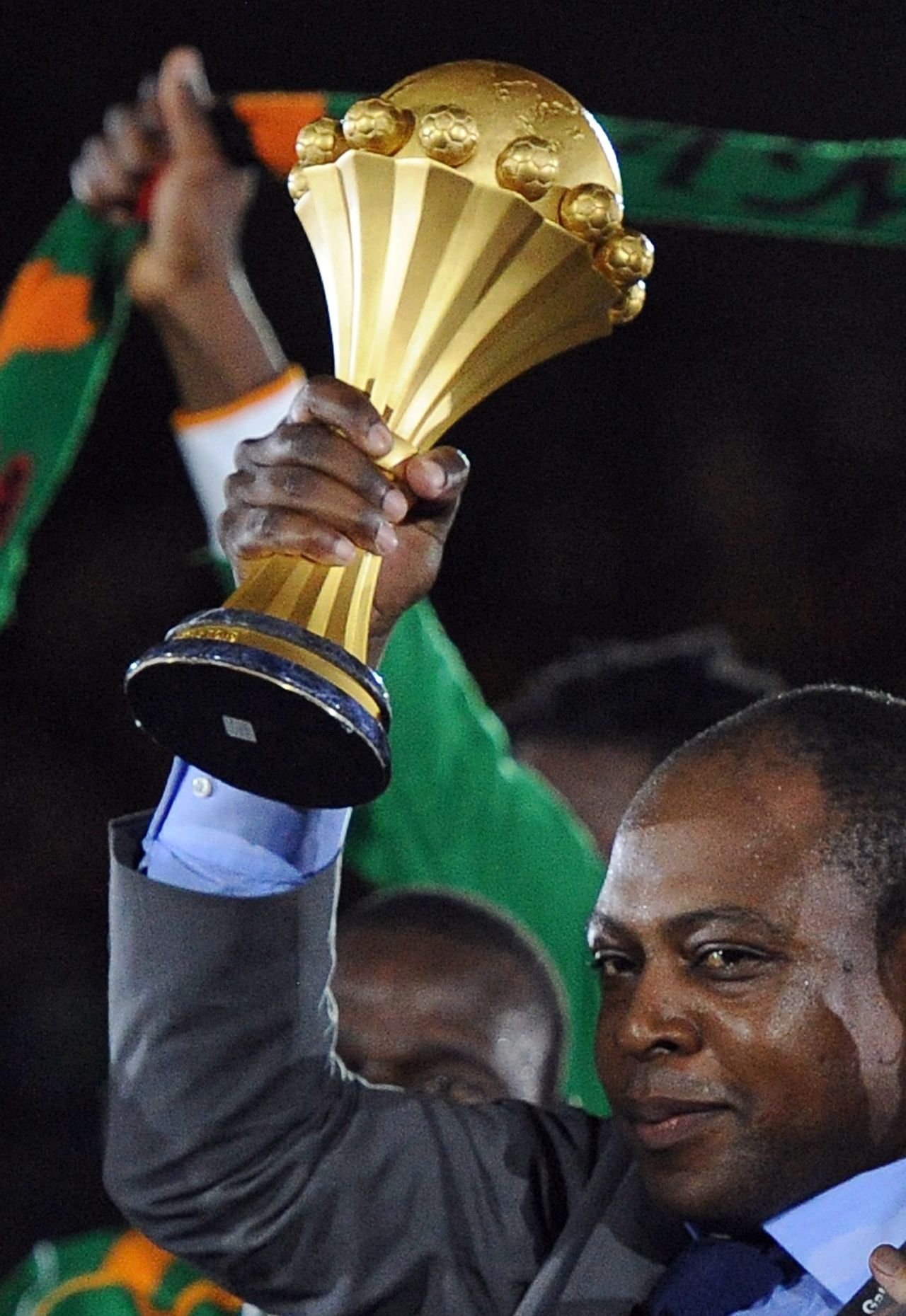 Former Zambia player Kalusha Bwalya holds the Africa Cup of Nations aloft after the Copper Bullets beat Ivory Coast in Sunday's final. Coach Herve Renard dedicated Zambia's historic first title to Bwalya, who is also head of the country's soccer federation.