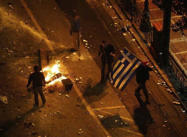 People are seen in the streets during the demonstration against the new austerity measures. 