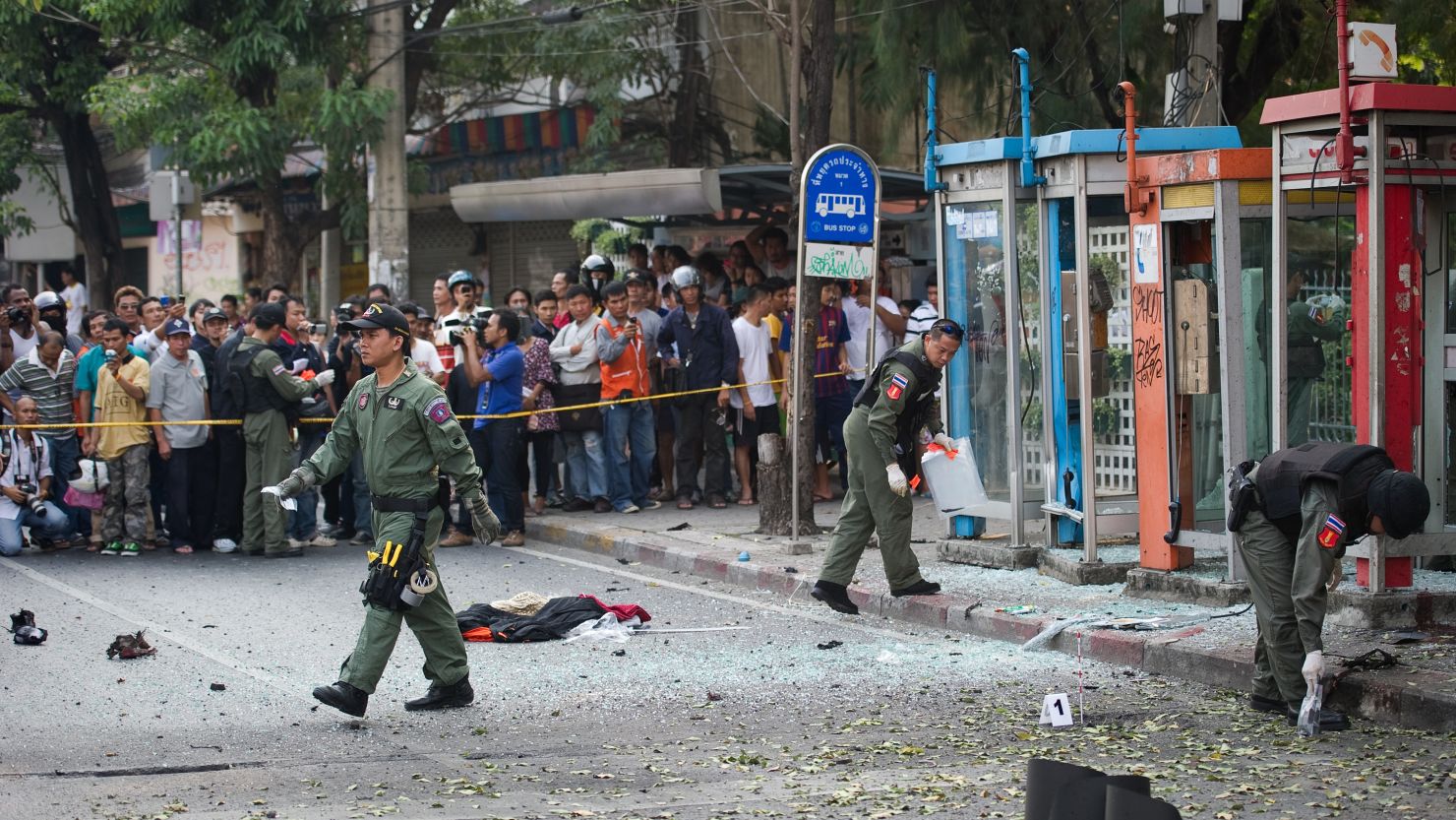 Thai bomb squad officials look at the site of an explosion in Bangkok on Tuesday. 