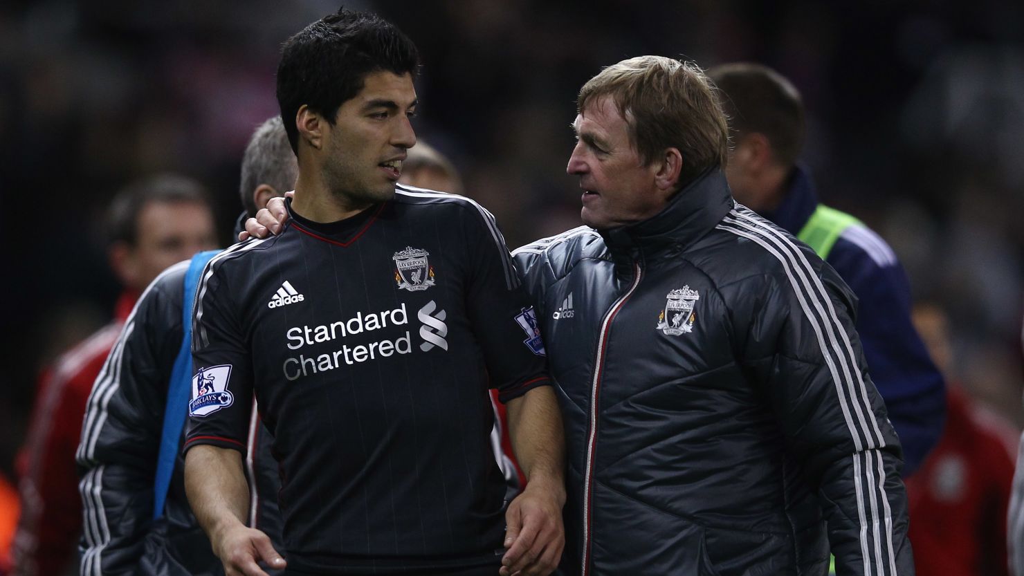 Luis Suarez and Liverpool manager Kenny Dalglish issued apologies on Sunday following the striker's handshake snub on Saturday