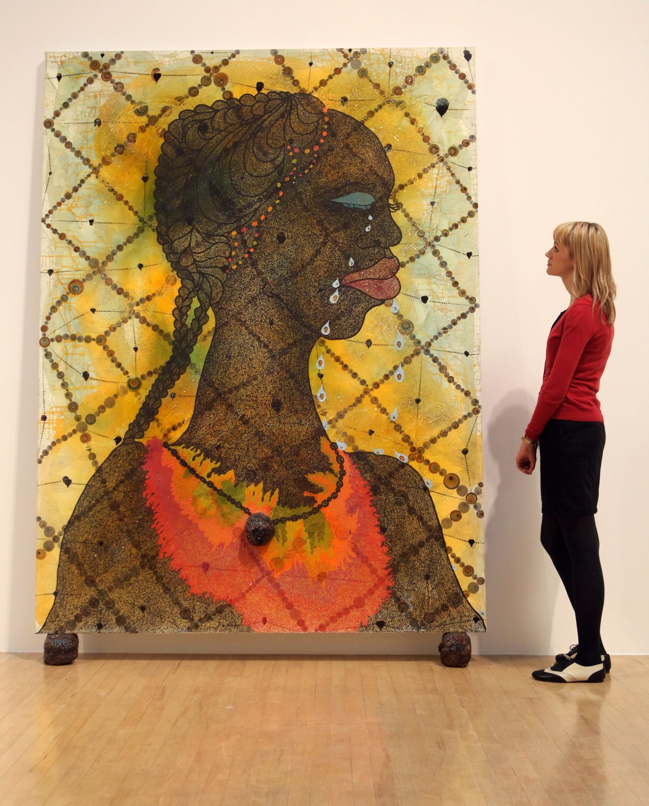 Artist Chris Ofili was born in Manchetser, England to Nigerian parents. His work has drawn inspiration from a research trip to Zimbabwe. He is a former winner of Britain's prestigious Turner Prize for art, and his works include "No Woman, No Cry," pictured.