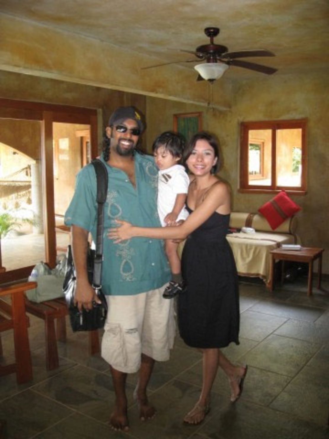 Jason Puracal with his wife Scarlett and their son Jabu.