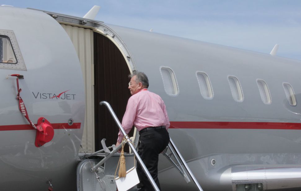  A visitor to the Singapore Airshow walks up the steps of a Bombardier personal jet. "The richest are the most casually dressed," observes David Velupillai of Airbus Corporate Jets.