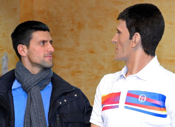 Sportsman of the year Novak Djokovic poses next to his likeness on February 9, 2012, at the wax museum in the central Serbian town of Jagodina.