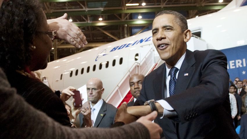 US President Barack Obama greets employees following a tour of the Boeing 787 Dreamliner production facility prior to speaking on the economy in Everett, Washington, February 17, 2012.