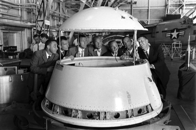 The original Mercury 7 astronauts inspect an early design of a space module. From left are Gus Grissom, Deke Slayton, Gordon Cooper, John Glenn, Scott Carpenter, Alan Shepard and Wally Schirra. In 1962, Glenn was the first American to orbit the Earth. <a href="index.php?page=&url=http%3A%2F%2Flife.time.com%2Fhistory%2Fjohn-glenn-unpublished-photos%2F%231" target="_blank" target="_blank">See more images at Life.com</a>