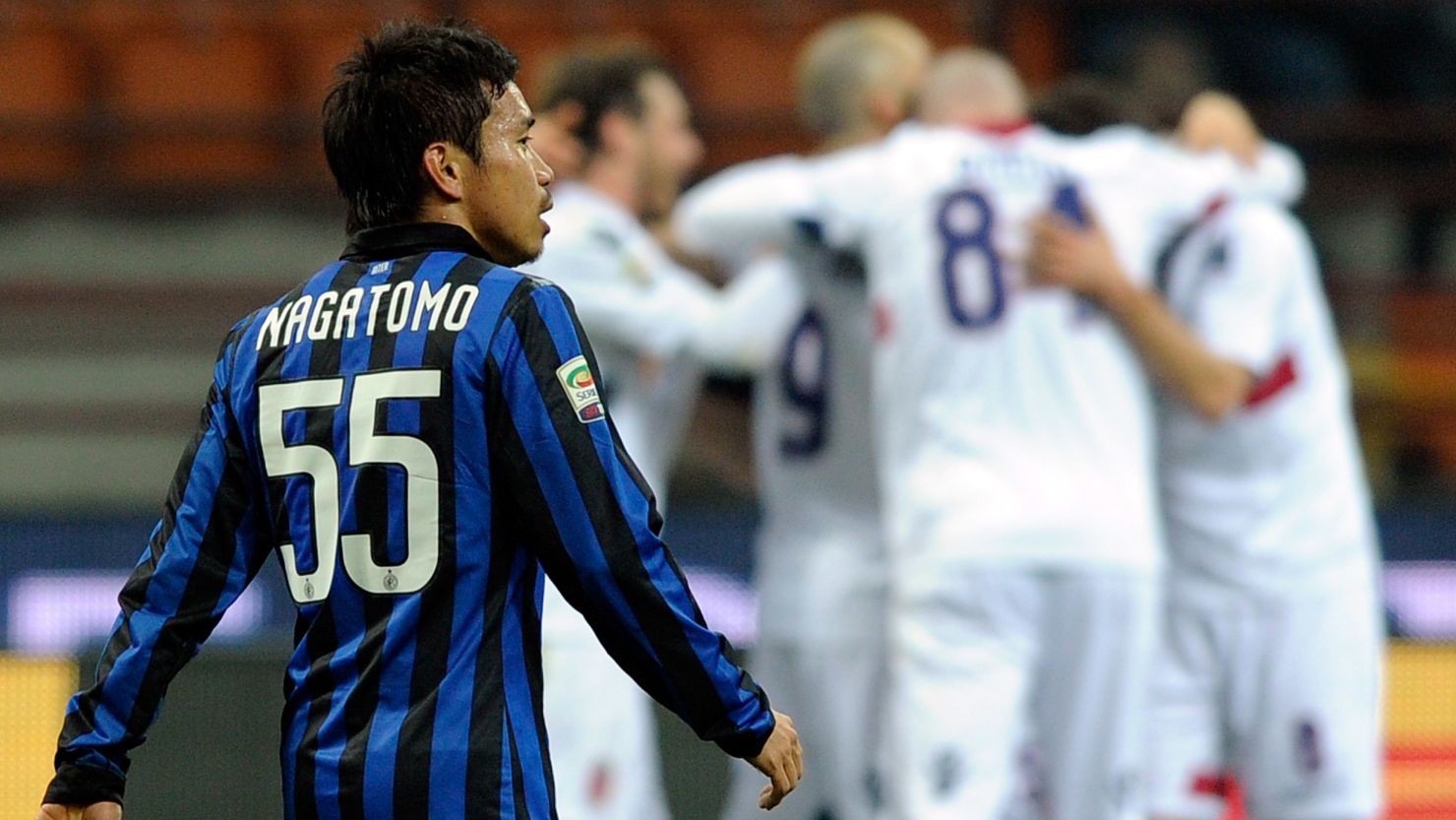 Inter's Yuto Nagatomo looks on as Bologna celebrate their second goal at the San Siro.