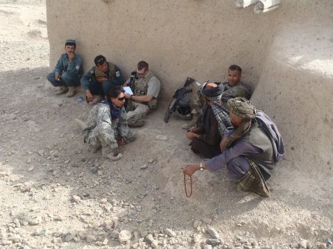 U.S. soldiers remind villagers in Shah Wali Kot, Afghanistan, about an upcoming shura, or council meeting.