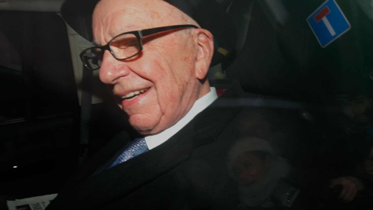 News Corporation Chief Rupert Murdoch leaves his London home to visit the offices of his British tabloid The Sun on February 17 