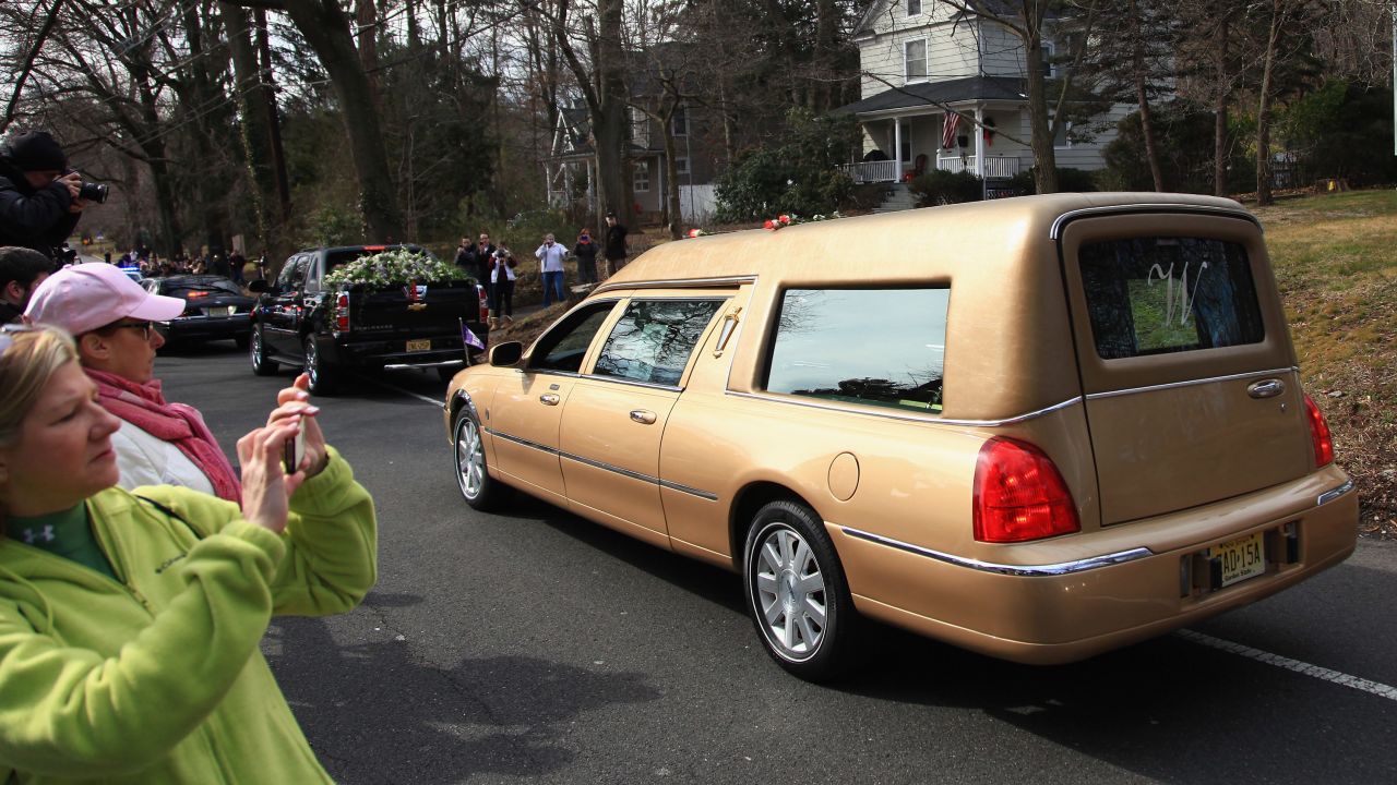 The hearse carrying the body of singer Whitney Houston arrives for her burial service Sunday in Westfield, New Jersey. 