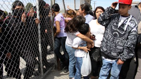 Dozens of people gather outside a prison in northern Mexico to find out if their family members were killed in a riot.