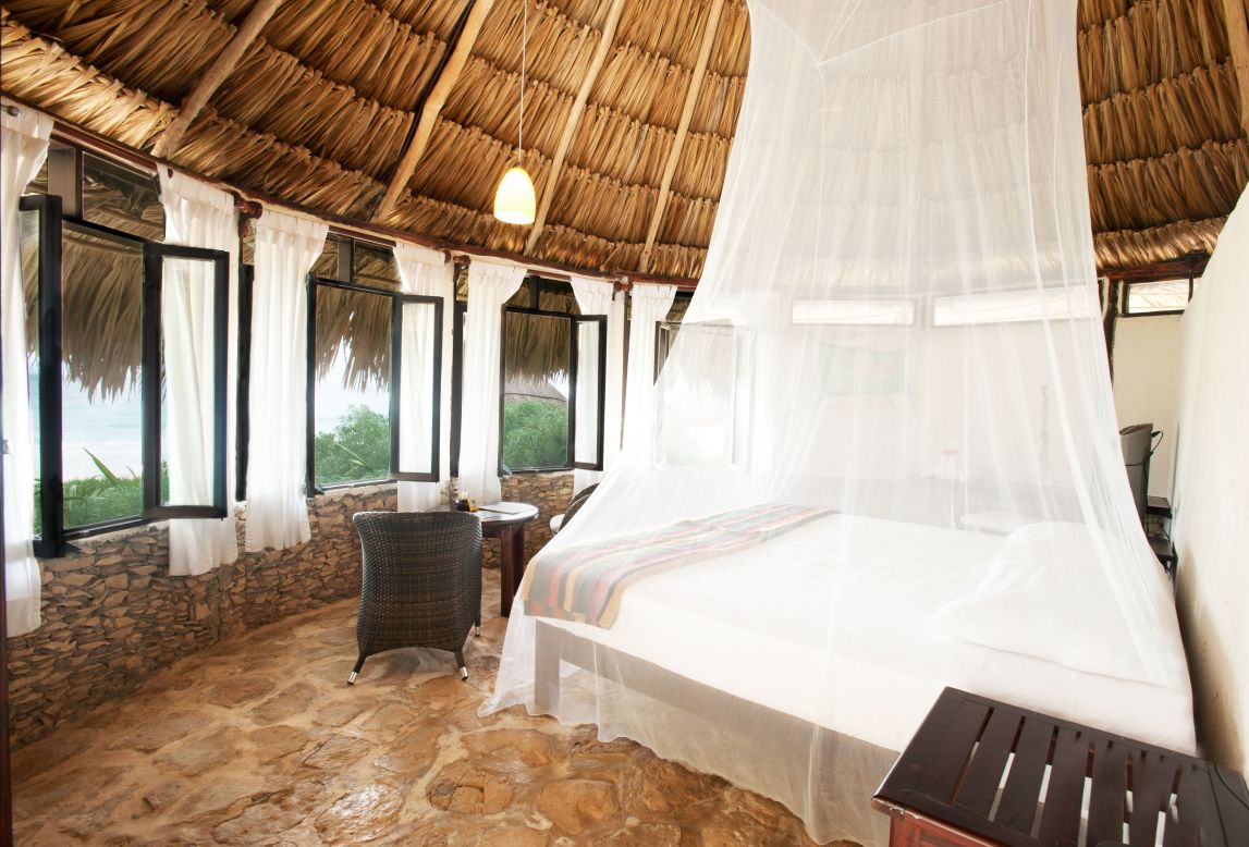 Go to sleep to the sound of waves lapping near your beachfront cabana at Maya Tulum.