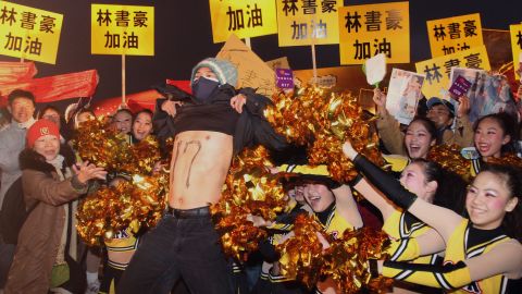 Fans of NBA basketball player Jeremy Lin celebrate in his family's hometown of Changhua, Taiwan, on Friday.