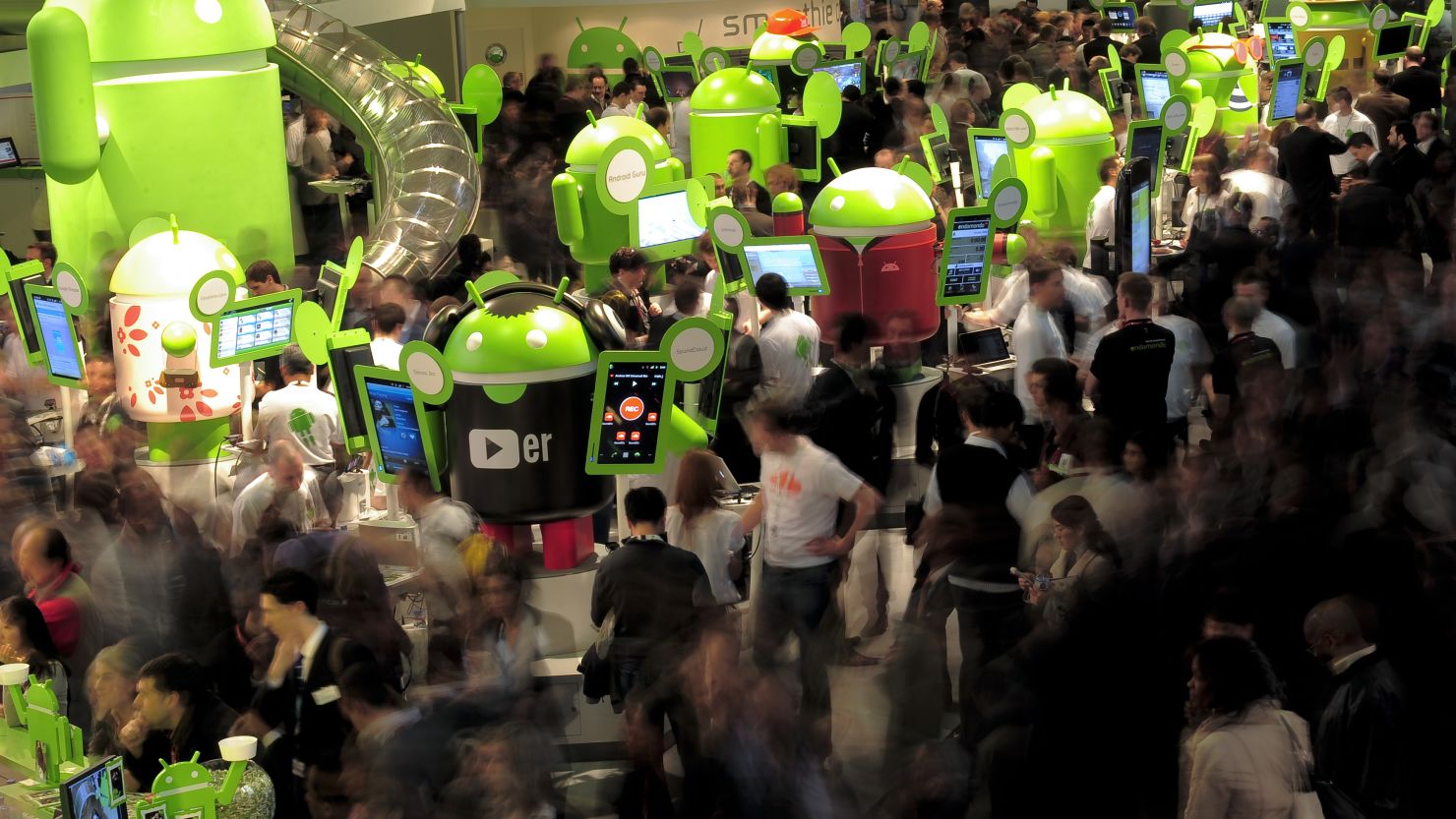 Participants throng around exhibits at the 2011 Mobile World World congress in Barcelona.