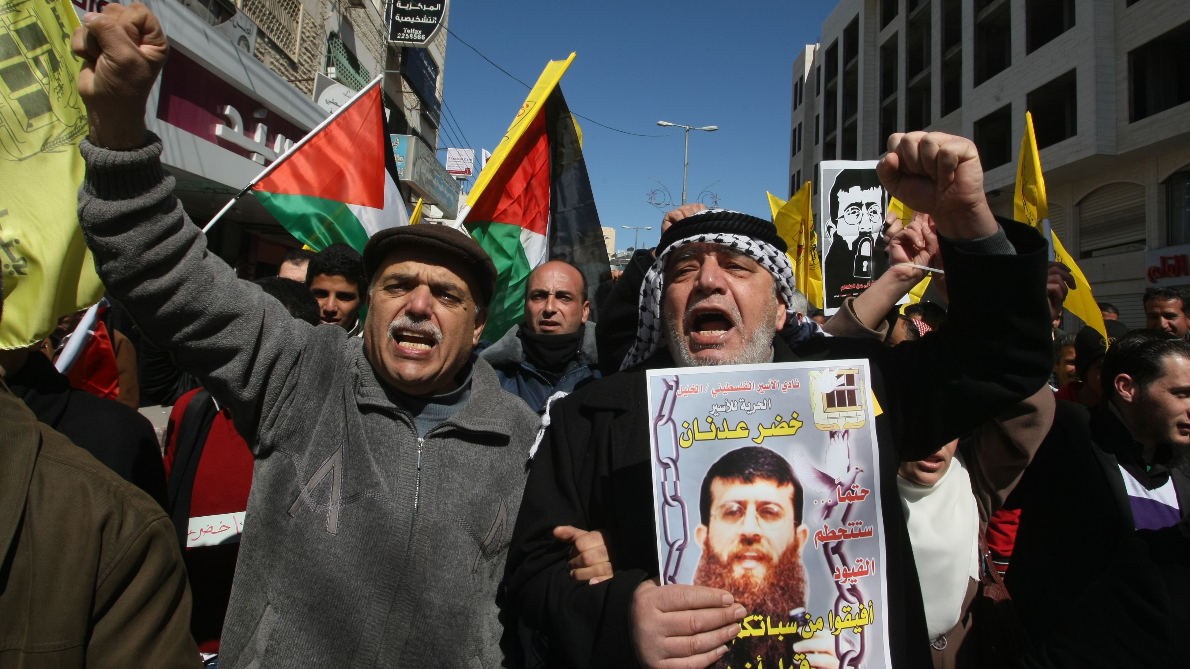 Palestinians rally in support of Khader Adnan shortly before Adnan ended his 66-day hunger strike on February 21, 2012.