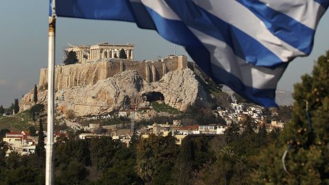 The Greek flag flies in front of the Parthenon on the Acropolis on February 17, 2012 in Athens, Greece. 