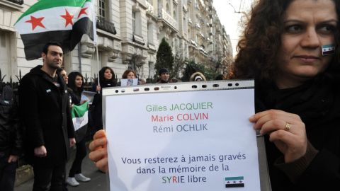 An anti-Syria regime demonstrator in Paris remembers journalists killed in Syria Wednesday.