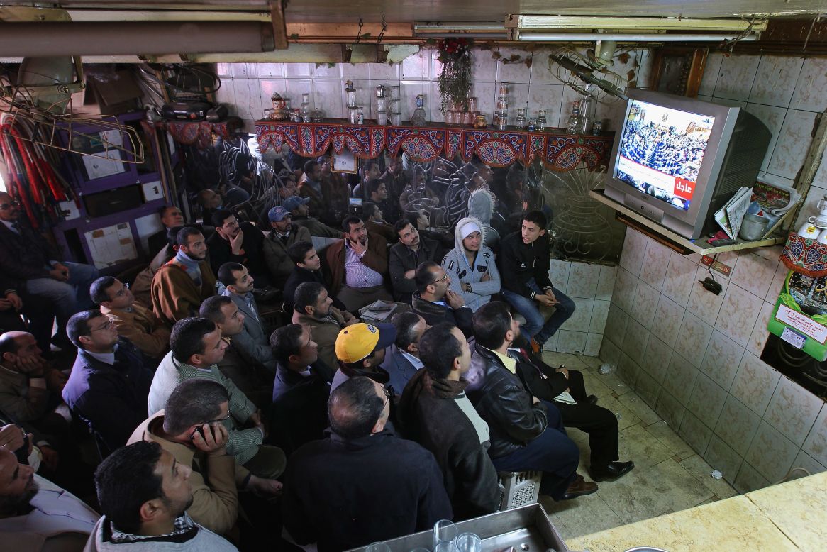 Now, in neighborhood cafes across Cairo, men tune in to daily political talk shows discussing Egypt's own crisis and fears for the future.