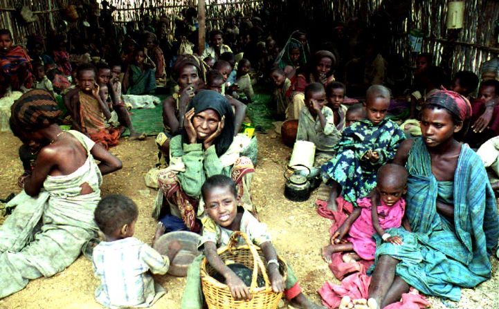 For over 20 years Somalians have faced the horror of famine and war. In this image from 1992, women and children sit inside a feeding centre run by the International Committee for the Red Cross (ICRC) in Baidoha, Somalia, during a period of extreme famine and drought that claimed 300,000 lives, according to the U.N. Security Council.