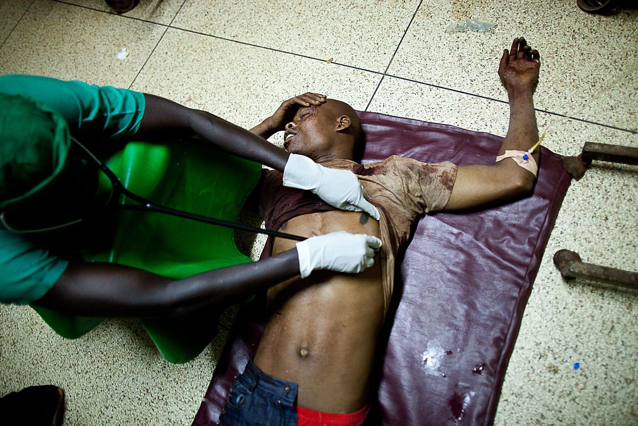 Al-Shabaab factions have carried out what appeared to many Somalis as senseless attacks. Here, a doctor treats a victim at Mulago hospital in Kampala late on July 11, 2010 after twin bomb blasts tore through crowds of football fans watching the World Cup final, killing 64 people, including an American, and wounding scores of others.