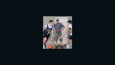 Chris Herren, center, launched a basketball clinic for kids the year after he got clean.