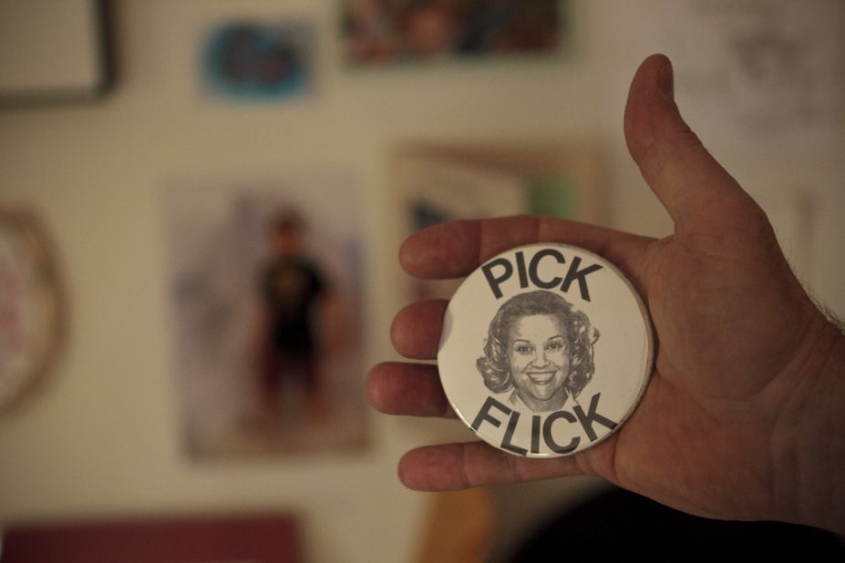 Tent holds one of the "Pick Flick" buttons Tracy Flick (Reese Witherspoon) handed out in "Election."