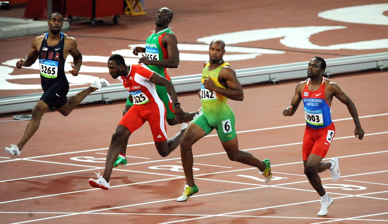 Prior to the Beijing Olympics, Gay was troubled by a hamstring injury which meant he arrived at the Games in less than perfect shape and he failed to win a medal. Here Gay (far left) finishes fifth in the 100m semifinal to miss out on the final, won by  Bolt in record time.