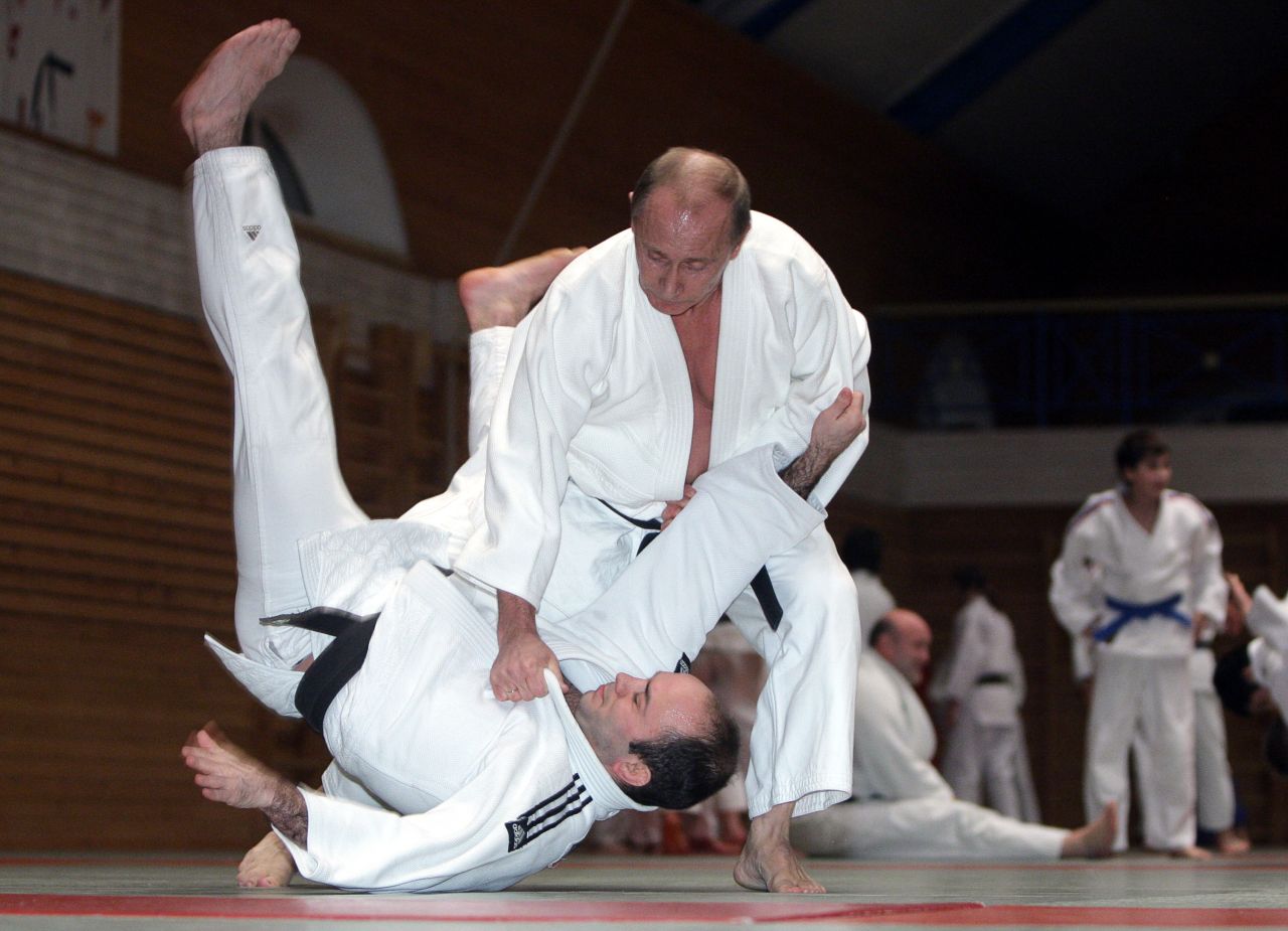 Famed for his love of martial arts, Putin throws a competitor in a judo session at an athletics school in St. Petersburg on December 18, 2009.