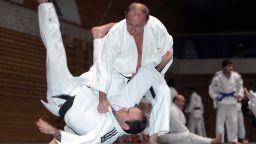 Russian Prime Minister Vladimir Putin (top) holds a judo training session at the Top Athletic School during his working visit to St Petersburg, on December 18, 2009 