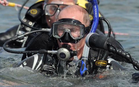 A wetsuit-clad Putin embarks on a dive to an underwater archaeological site at Phanagoria on the Taman Peninsula on August 10, 2011.