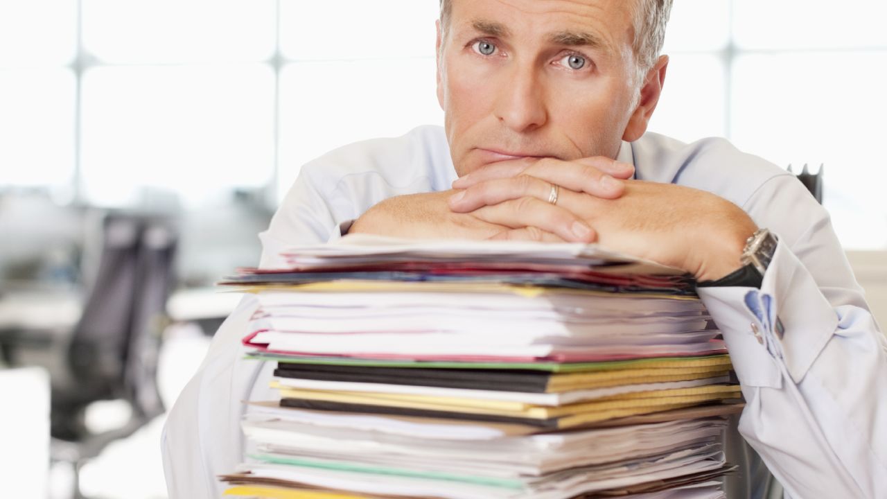 An office worker with a stack of papers.