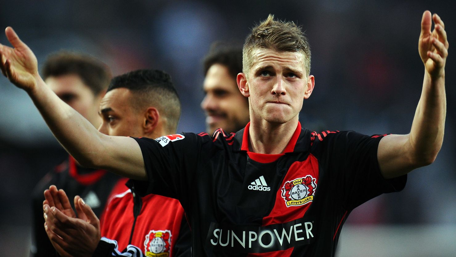 Bayer Leverkusen's two-goal hero Lars Bender celebrates after Saturday's win over Cologne.