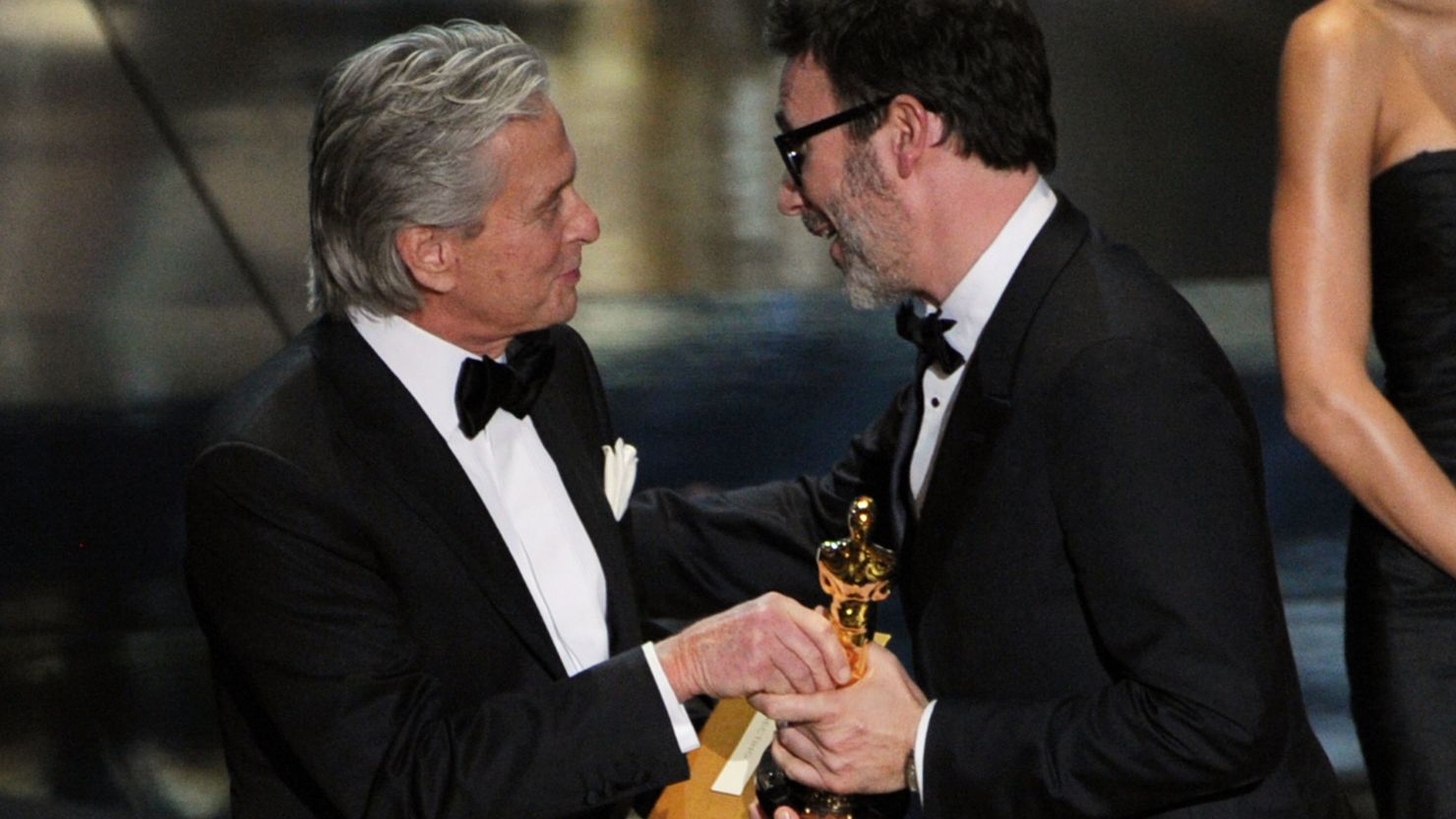 Michel Hazanavicius accepts the Best Director award for "The Artist" from presenter Michael Douglas on Sunday night.